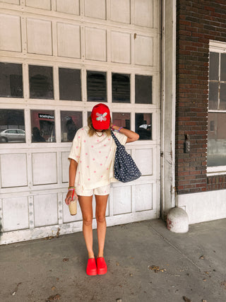 powder blush polka dot top